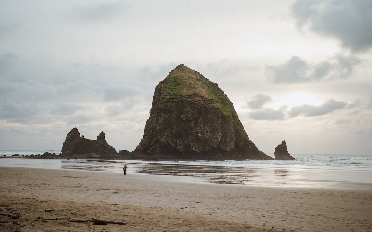 Haystack rock, a giant rock monolith rising out of the Oregon Coast at Cannon Beach